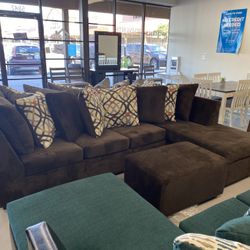 Brown Sectional With Designed Pillows 