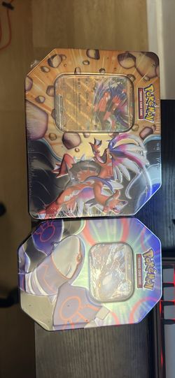 Two brand new pokemon tins