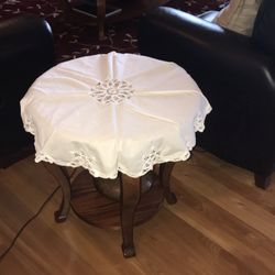 Antique Table Covering With beautifully cutout designs around the edges white round