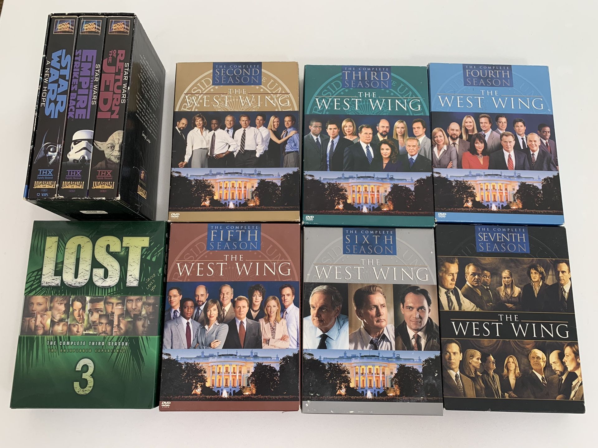 West Wing Seasons 2-7 and 3 Star Wars on VHS tapes + Lost Season 3 in DVD.