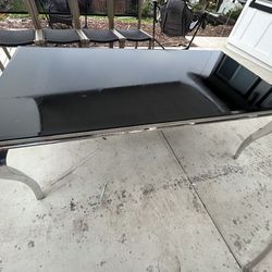 Black glass table with chairs