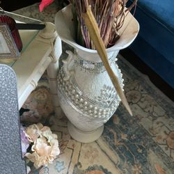 A Gorgeous New, 24” Tall White Vase, With Designs, ( A Small Broken Piece On Top) It Can Be Hide (NO SHIPPING) It Cost $65, Selling For $20