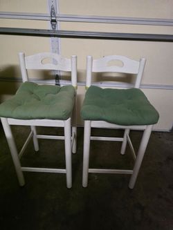2 white wood bar stools