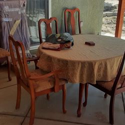 Dining room table with leaves and tablecloths and dinner mats