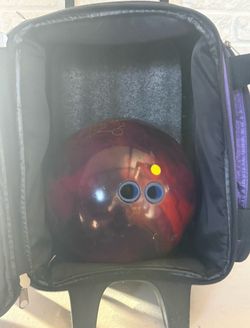 BRUNSWICK DOUBLE ROLLER BAG WITH zero gravity bowling ball and bowling bag new in condition Ball weight is 15lbs