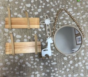 Nursery décor: floating shelves, mirror and decor iteams