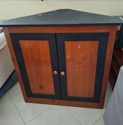 Wood corner TV stand storage.