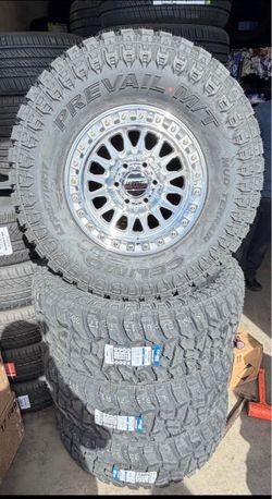 17 INCH KMC IMS SILVER MACHINE +35x12:50R17 MT TIRES AVAILABLE