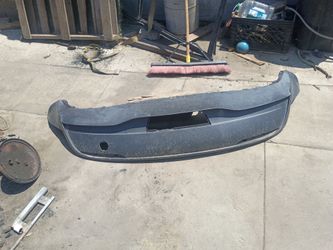 Tesla  Model Y (Model years 2020 through 2024). Lower rear bumper cover
