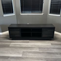 Black Entertainment Center with Glass Doors and Adjustable Shelves