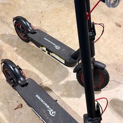 Two Evercross Electric Scooters