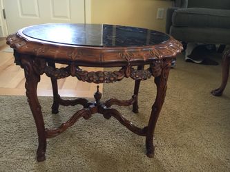 1920’s marble top mahogany tea table. Measures 25”L x 19”W x 18”H. From my grandma’s estate.