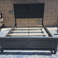 Gray panel bed frame from the Ashley Furniture Lanolee collection