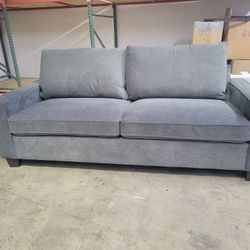Living Spaces Reid Sofa -grey with wood legs