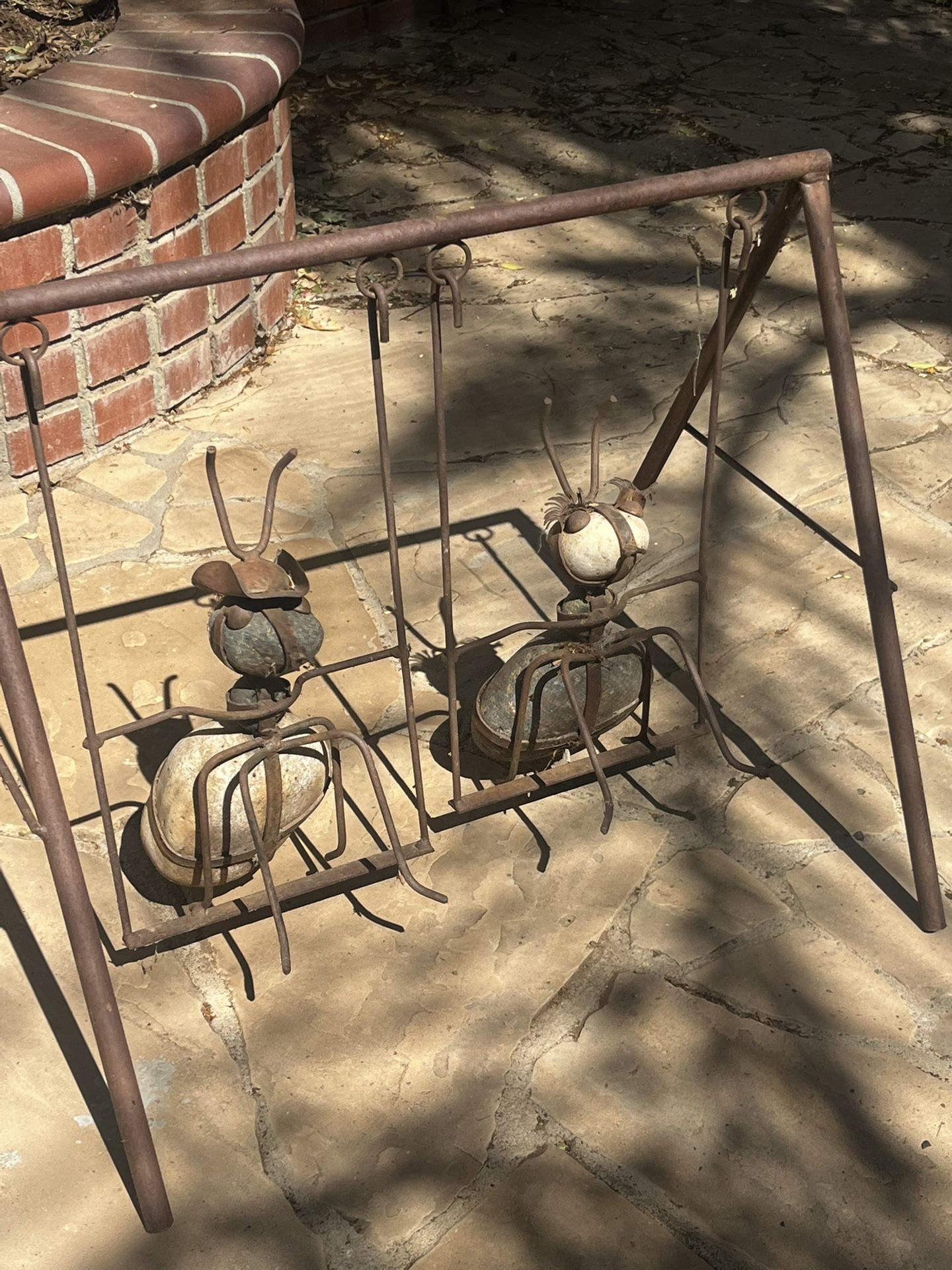 Rustic Ants On A Swing Garden Decor Wrought Iron And Stone