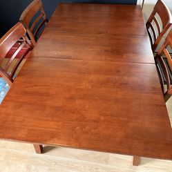 Ashley hidden leaf dining table with four chairs
