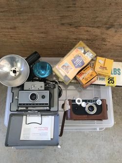 Vintage cameras - Polaroid 230 Land, Argus in leather case, lighting
