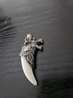 Faux wolf tooth pendant
