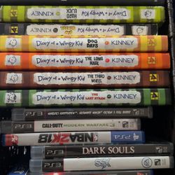 Assortment Of Books And Old Games