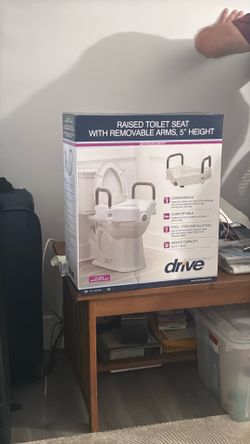 Raised toilet seat with removable arms