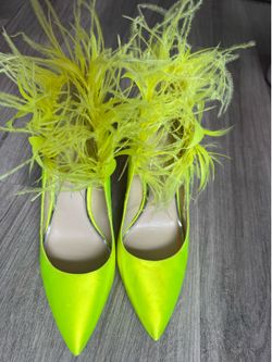 Neon yellow feathered heels