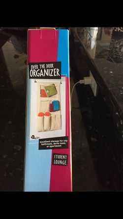 Brand New Over The Door Organizer. Excellent storage for any bathroom, dorm room, or apartment.