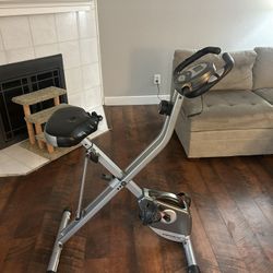 Exerpeutic Foldable Exercise Bike, 8 levels of Resistance Stationary Bicycle with Airsoft Seat, LCD Display to Track Distance, Calories.