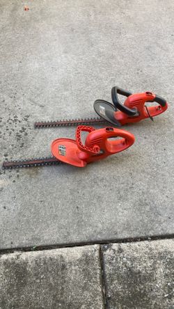 A pair of Black & Decker hedge trimmers