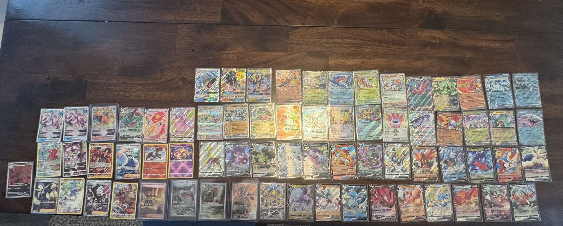 70 card lot of various ir’s ar’s ex’s gx’s vmax vstar and v cards.