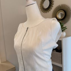 modern sleeveless white top.