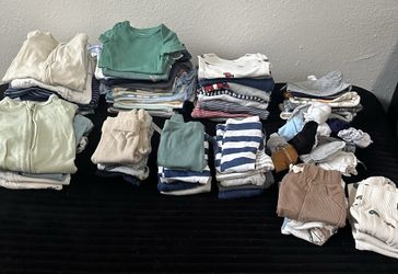 Baby boy cloches and a box of diapers