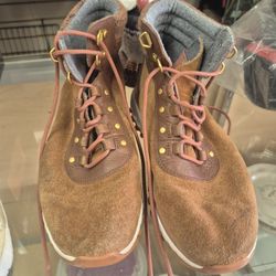 pair of Cole Haan Zero Grand Explore brown suede fleece-lined ankle boots. 