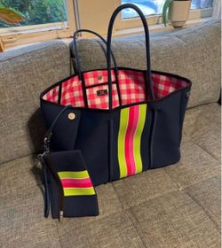 Taylor Gray navy neoprene tote bag with a pink and lime green accent stripe.