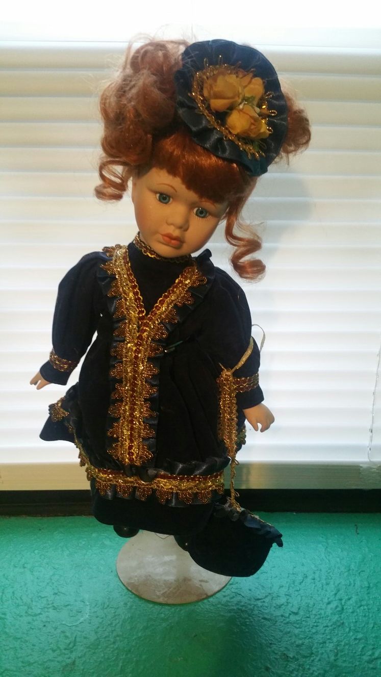 Antique Doll..with stand