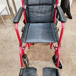 wheel chair with brakes on wheels and handles