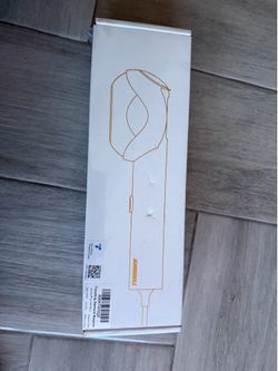New GROBELL traveling garment steamer is model GS-055. This white handheld device has a power rating of 120V, 60Hz, and 750W. It is designed and engin
