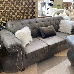 Gray chesterfield style sofa