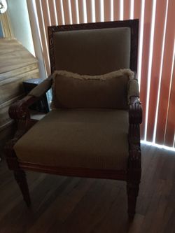 Vintage looking highback armchair with pillow