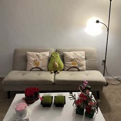 Bed sofa and a floor lamp