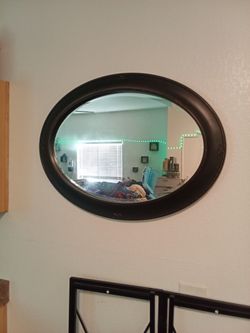 Oval Wall Mirror with Dark Frame $20