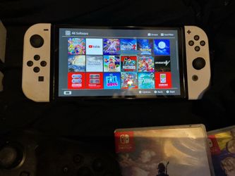 Nintendo switch OLED with dock,chargers controller, and games