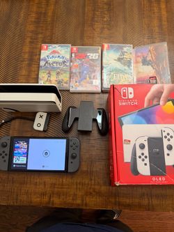 Nintendo switch OLED bundle w pokemon and free transformer toy