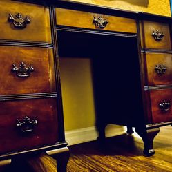 An English, Edwardian hand carved pedestal desk, on 8  cabriolet feet.  Fine Mahogany smooth top, one frieze drawer,  three dovetail drawers on each s