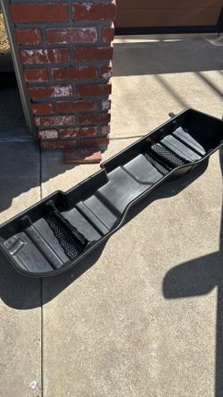 Silverado underseat  (rear ) storage tray .  This is a Chevrolet original part sits under the rear seat