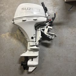 white suzuki 20 hp boat engine