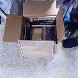 A Box Of Picture Frames Old And New With Glass