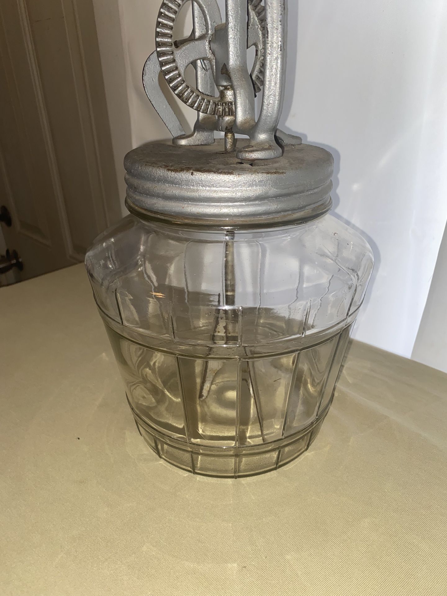 antique butter churn with glass basket style bottom