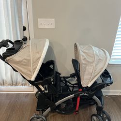 Baby Trend Sit N' Stand Easy Fold Toddler Baby Double Stroller and 2 Infant Comfortable Carry Car Seats Travel System Combo, Magnolia