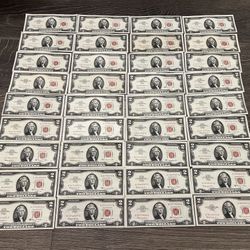 Rare lot of 66 $2 dollar bills red seal currency notes.