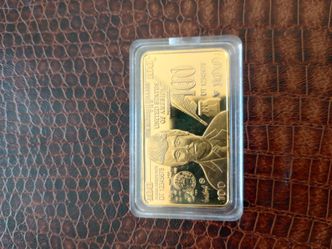 Trump 100 Gold bar